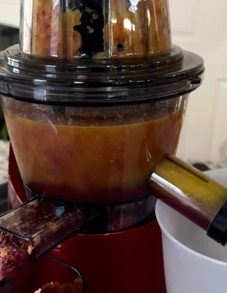 Refreshing carrot, strawberry, and grapefruit juice in a glass