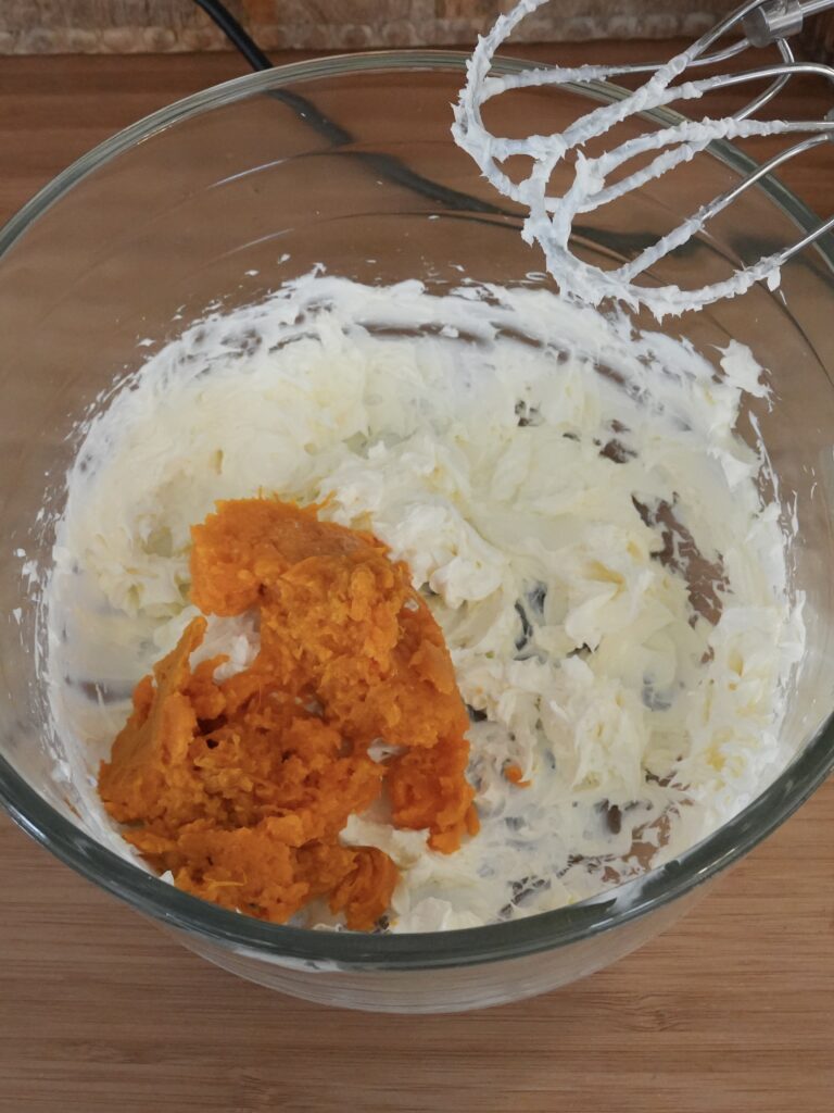 Add the cooled mashed sweet potato and continue beating until fully integrated