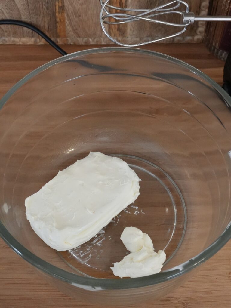 beat the softened cream cheese on medium speed